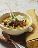 Risotto with skewered chicken livers