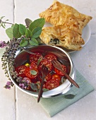 Puff pastry turnovers with feta filling, with tomato salad