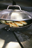 Fried potatoes in a frying pan