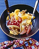 Fruit salad with walnuts and linseed oil