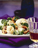 Tortellini with fried mushrooms, corn salad & cream sauce