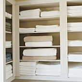 Towels and sheets on shelves