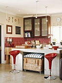 Bar stools in front of a kitchen unit
