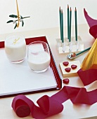 A child's desk with glasses of milk