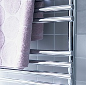 Bath towel hanging on a heated towel rail