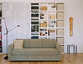 Couch in front of large office cupboard with sliding doors