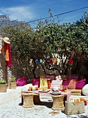 Floor cushions and table in garden