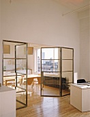 View into kitchen with dining table