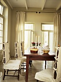 Dining table and chairs with loose covers