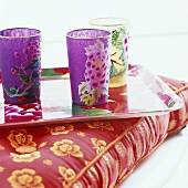 Colourful drinking glass on tray