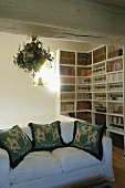 A living room with a view of a bookcase