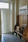 A hallway with a wooden bench