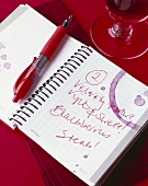 Notebook with red wine stains