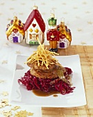 Burgers on cranberry red cabbage with beer gingerbread sauce