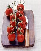 Vine tomatoes on chopping board
