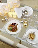 Laid Christmas table with roast duck