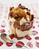 Ice cream sundae with caramel and pecan sauce