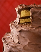 Three-tiered chocolate wedding cake, a piece removed