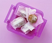 Almond balls in a plastic box