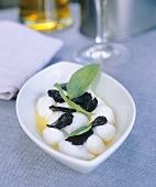 Poached quails' eggs with olive oil, basil and truffle