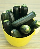 Courgettes in a yellow bowl