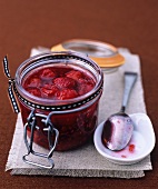 Baked raspberry jam in a preserving jar