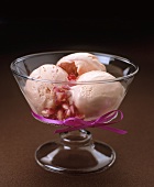 Three scoops of pink champagne parfait with pomegranate seeds