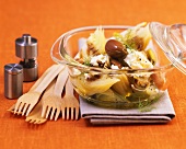 Fennel with feta cheese and olives in glass dish