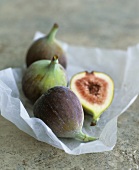 Fresh figs, whole and halved on paper