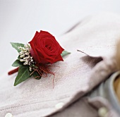 Corsage with rose on linen shirt