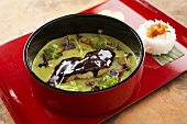 Green fish curry with chocolate glaze