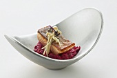 Arctic charr with enoki mushrooms on beetroot risotto