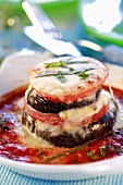 Baked aubergine and tomato tower with melted cheese
