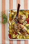 Chicken legs on peppers, leeks and potatoes (oven roasted)