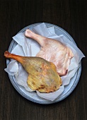 Raw and roast goose legs