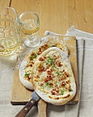 Tartes flambées with traditional onion and bacon topping