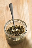 A portion of balsamic lentils with apple in a screw-top jar