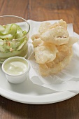 Tempura appetisers with mayonnaise & glass of cucumber salad