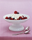White chocolate mousse with berry sauce