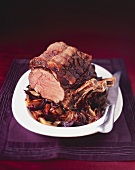 Roast rib of beef with port wine sauce and balsamic onions