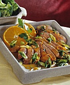 Duck breast with orange sauce and spring onions