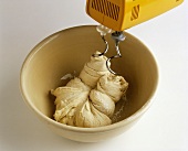 Kneading yeast with the dough hook of a food mixer