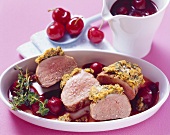 Pork fillet in herb crust with cherry and port wine sauce