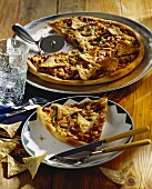 Pizza Mexicana topped with jalapenos, sweetcorn & tortilla chips