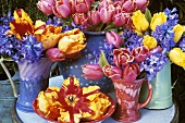 Vases of tulips and hyacinths out of doors