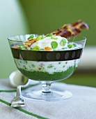 Bean puree with bacon in a glass