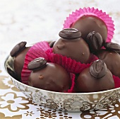 Chocolate-coated marzipan balls with nuts