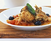 Braised rabbit with tomatoes and olives