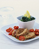 Meatloaf with cherry tomatoes and spinach