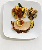 A slice of bacon-wrapped cured pork with vegetables